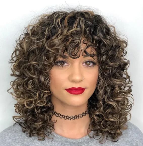 Medium Curly Hair with Luscious Bangs