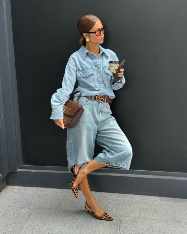 Women wearing denim culottes, light-wash button-ups, animal-print flats, and a belt.