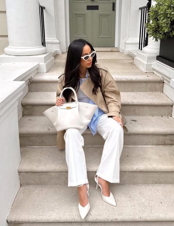 Beige and white outfit with a trench coat to create chic, stylish layers.