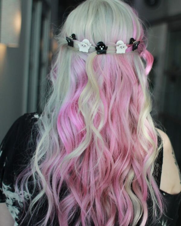 View back of pastel-colored ombre hair with soft waves, with ghost-shaped clips.