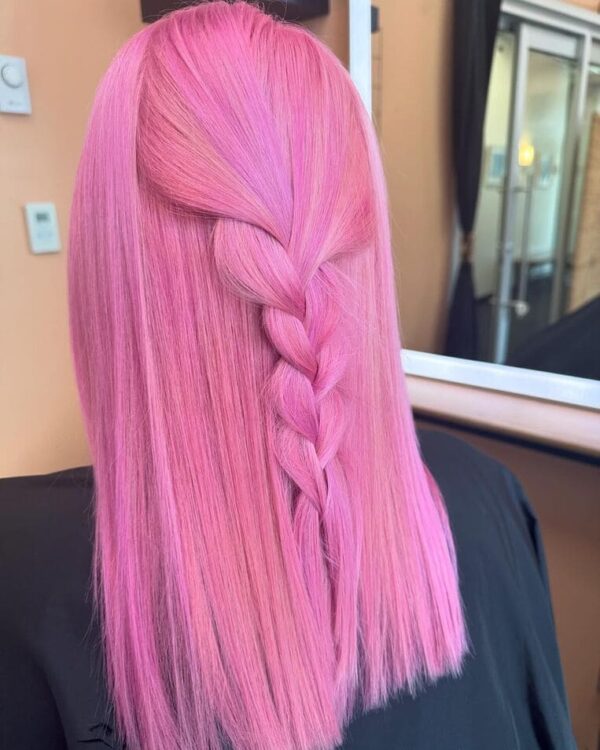 Bubblegum pink hair with a subtle braid down the back.