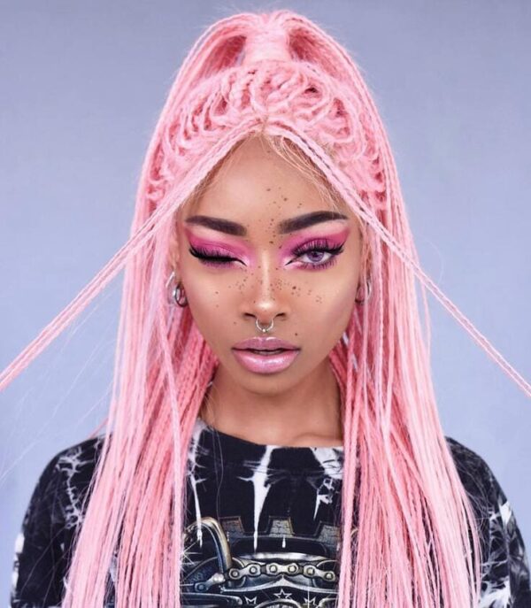 Front view of a long pink wig styled with intricate braids and a high ponytail.