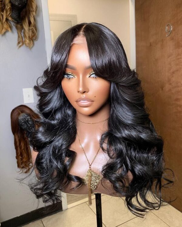 A front view of a black wig with long, soft curls and curtain bangs creates a romantic and sophisticated look.