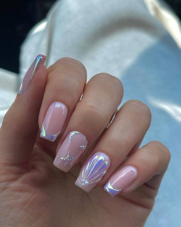 Soft pink square nails with holographic French tips and delicate seashell and starfish 3D designs.