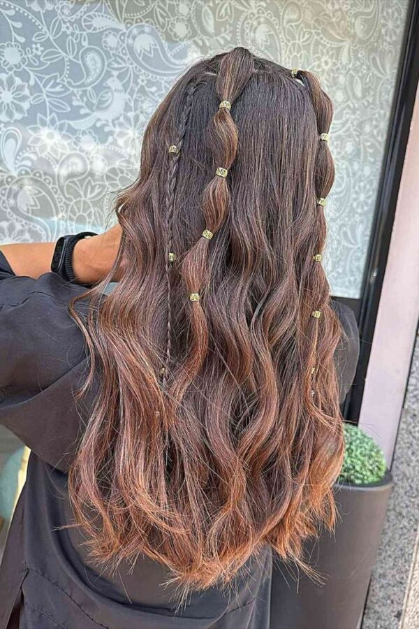 Long wavy hair with braids and gold bead accents