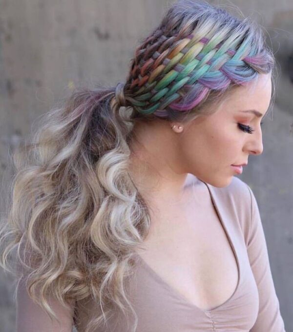 Colorful basket braid with rainbow highlights and loose wavy ponytail